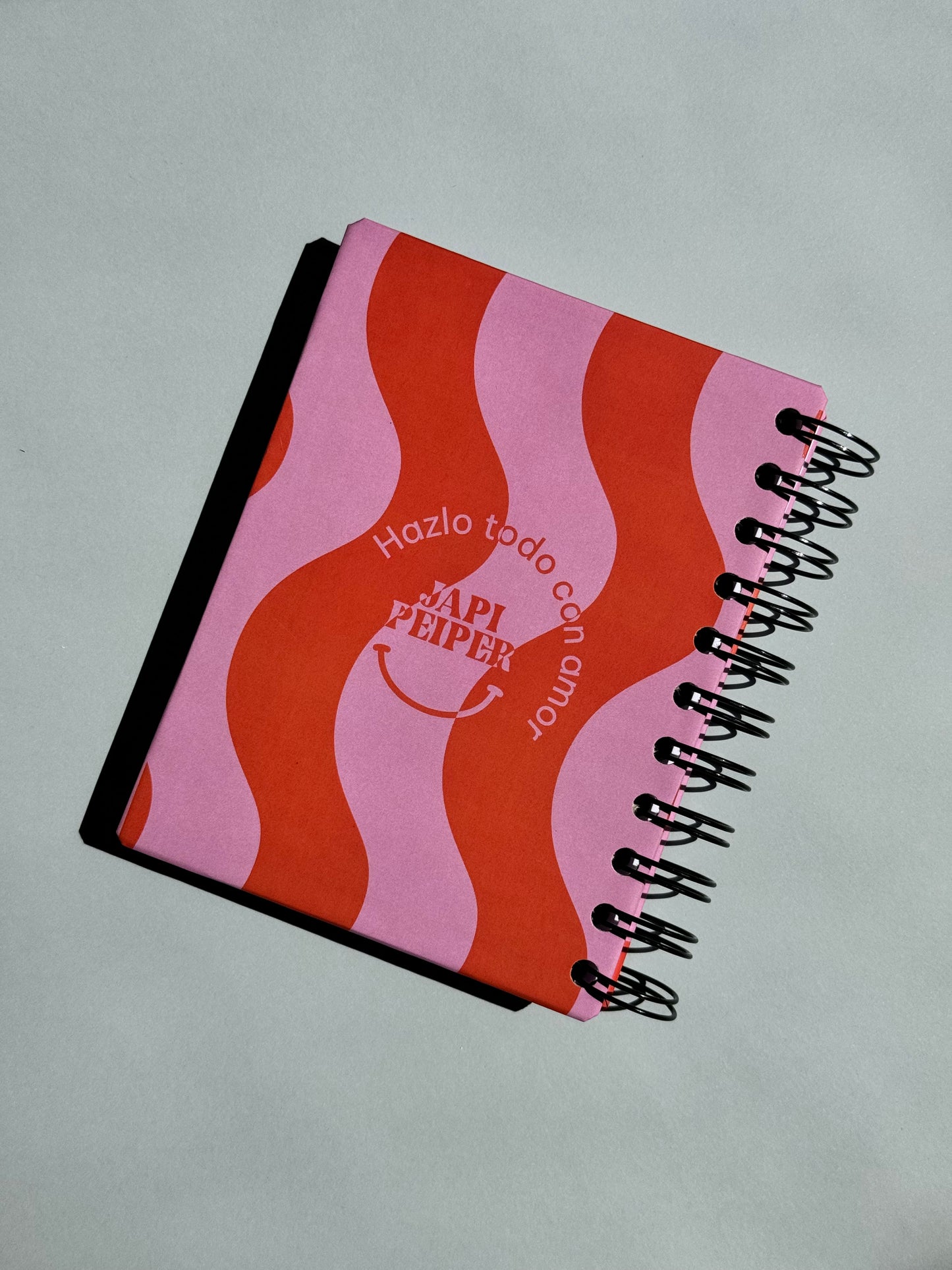 Libreta mini rosa y naranja.